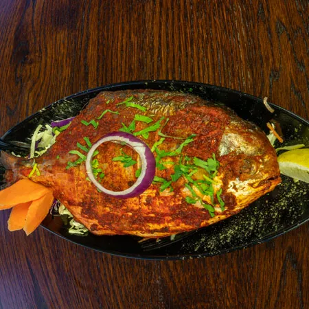 Whole fish, clay oven.